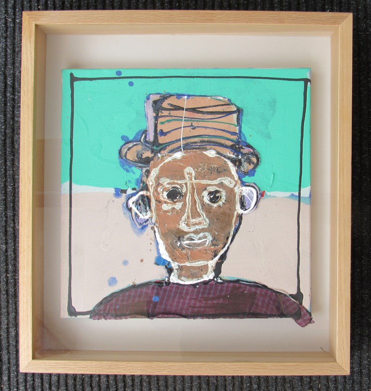 JOHN KIKI (b.1943): A framed and glazed oil cut out on canvas portrait of a man in hat, unsigned. - Bild 2 aus 2