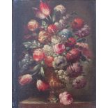 A late 18th/early 19th Century Dutch oil on board still life study of flowers in a vase set in an