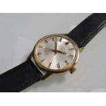 RECORD: a steel and gold plated gent's wristwatch with silvered dial and baton markers,