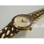 A Gucci gold plated lady's quartz bracelet watch with mother of pearl dial, case back no. 3300.2.