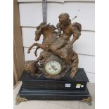 A late 19th Century French figural mantel clock surmounted by horse and rider hunting a lion black