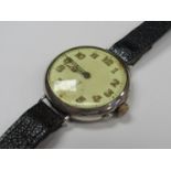 An early 20th Century silver cased trench watch, Arabic luminescent numerals,