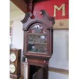 A Georgian oak longcase clock with brass arched dial with Roman chapter ring,