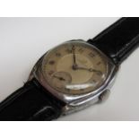 OMEGA: An early 20th Century chromed cushion cased gent's wristwatch,