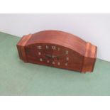 A walnut veneered mantel clock of Deco design with chrome Arabic numerals and hands,