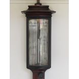 An early to mid 19th Century mahogany marine stick barometer with moulded thermometer box,