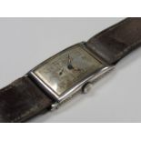 An early to mid 20th Century silver cased wristwatch of rectangular convex form,