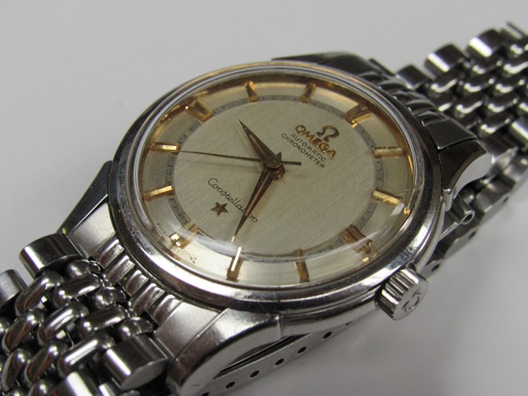 OMEGA: A Constellation automatic chronometer steel cased gent's bracelet watch,