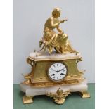 A French gilt and onyx mantel clock surmounted by a maiden with bird, Roman enamelled dial,