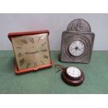 A leather cased travel alarm clock,