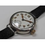 WALTHAM: An early 20th Century silver cased trench watch, Arabic luminescent numerals and hands,