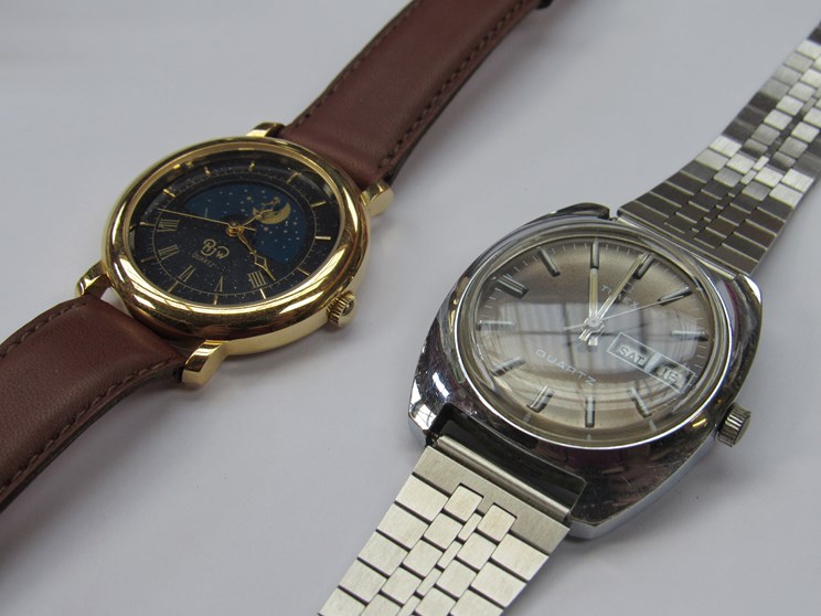 A Raymond Weil quartz moonpahse wristwatch and a Timex steel cased quartz wristwatch