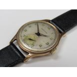 GARRARD: A 9ct gold mid 20th Century gent's wristwatch,