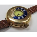 An early 20th Century half hunter trench style wristwatch marked 18K, dial, enamel and case all a/f,