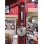 An early 19th Century mahogany and strung inlaid 8" wheel barometer with broken pediment top,