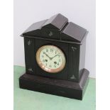 A Victorian black slate mantel clock of architectural form,