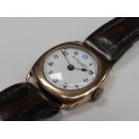 An early to mid 20th Century 9ct gold cushion cased gent's wristwatch,