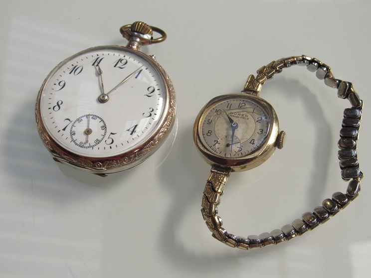 A Buren 9ct gold lady's watch and a Continental white metal pocket watch