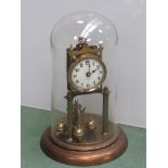 A brass anniversary clock with enamel face and Roman numerated dial,