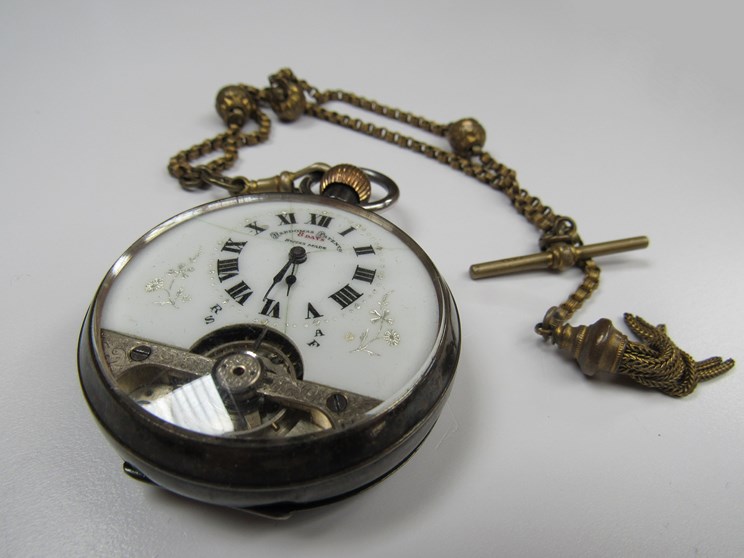 A Hebdomas 8-day open faced silver pocket watch with visible balance, dial hairlined,