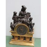 An early to mid 19th Century French gilt brass and bronzed spelter figural mantel clock,