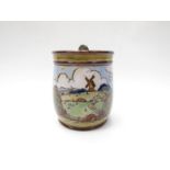 A Doulton Lambeth biscuit barrel with hand-painted and glazed rural scene. Patent lid fastener.