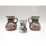 A pair of Mason's Ironstone jugs with chinnoiserie pattern and dragon handles and another