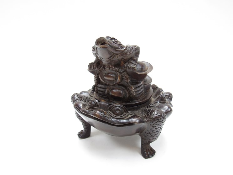 A Chinese bronze censor in the form of the three toads with another surmounting lid.