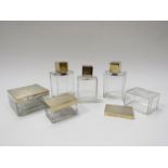 An Asprey's six-piece dressing table set comprising a pair of glass bottles with stoppers and