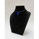 A modern necklace hung with blue enamel lozenge marked 925