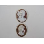 A Victorian cameo brooch and a 20th Century similar example