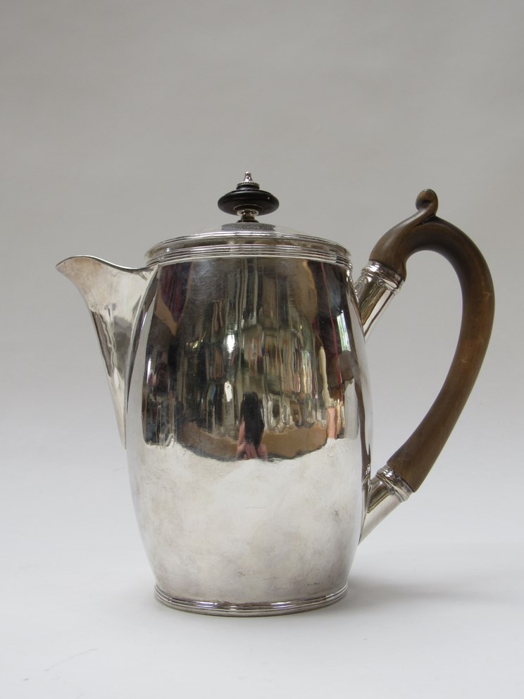 A George III silver hot water/coffee pot with treen finial and handle, London 1791 with banded rim ,