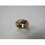 An 18ct gold ring, set with three forget-me-not patterns of seven diamonds, Birmingham,