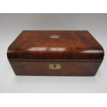 A Victorian walnut writing box with green velvet slope