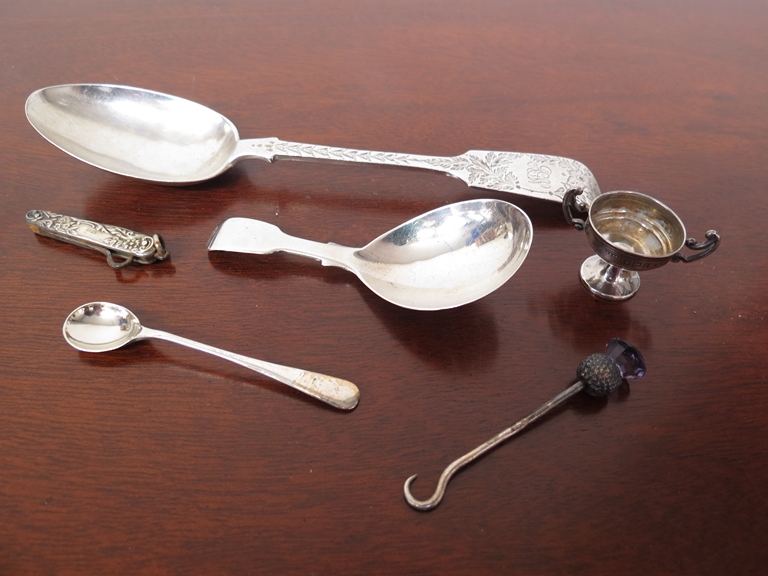 A silver tablespoon, Victorian silver caddy spoon and silver miniature trophy,