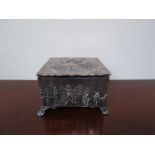 A Thomas Hayes silver jewellery casket with figures in high relief in vintage scenes,