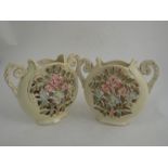 A pair of Victorian vases with pierced floral design