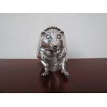 An Asprey novelty silver hedgehog money box/bank (London 1990), 10cm high,