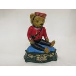 A cast iron door stop in the form of a Teddy Bear Doorman