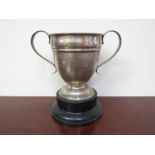 A silver twin handled engraved trophy on base, "Challenge Cup", London 1922,