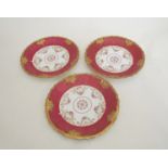 A set of ten red and floral Limoges plates