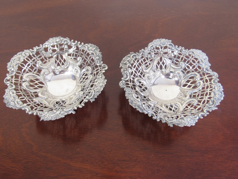 A pair of William Comyns and Sons silver pierced bon-bon dishes, wavy form rim, marked London 1892,