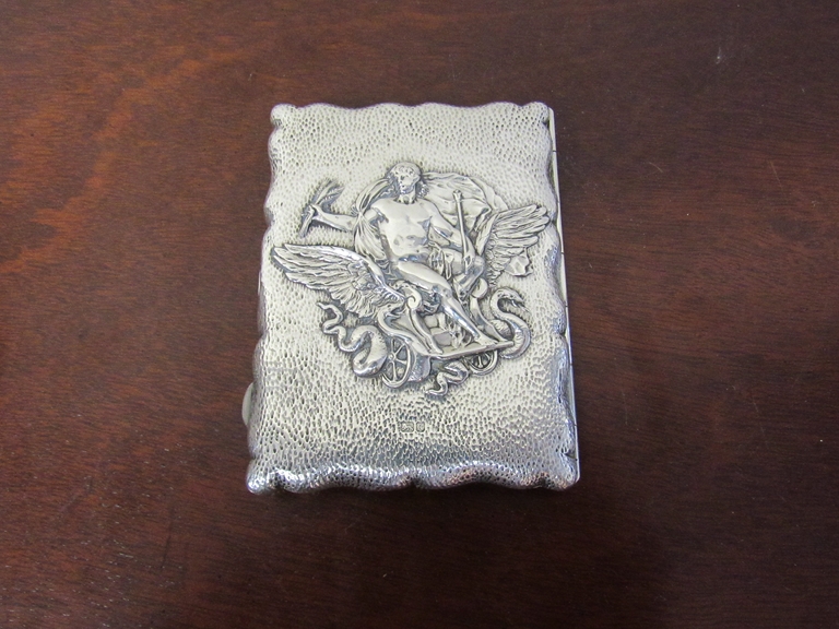 A silver embossed card case/aide memoire depicting Triptolemus on a winged chariot with serpents,