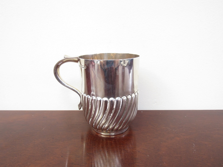 A Mappin & Webb silver cup, scroll handle, half wrythen form body, Sheffield 1903,