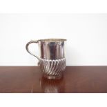 A Mappin & Webb silver cup, scroll handle, half wrythen form body, Sheffield 1903,