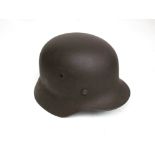 A WWII German M40 helmet with associated liner