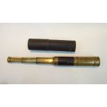 A 19th Century brass three draw telescope with leather binding and original card tube