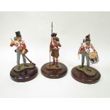 Three military cast figures of Napoleonic drummer and two infantrymen