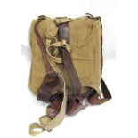 A WWII Sam Browne Home Guard belt with pouches together with a webbing back pack