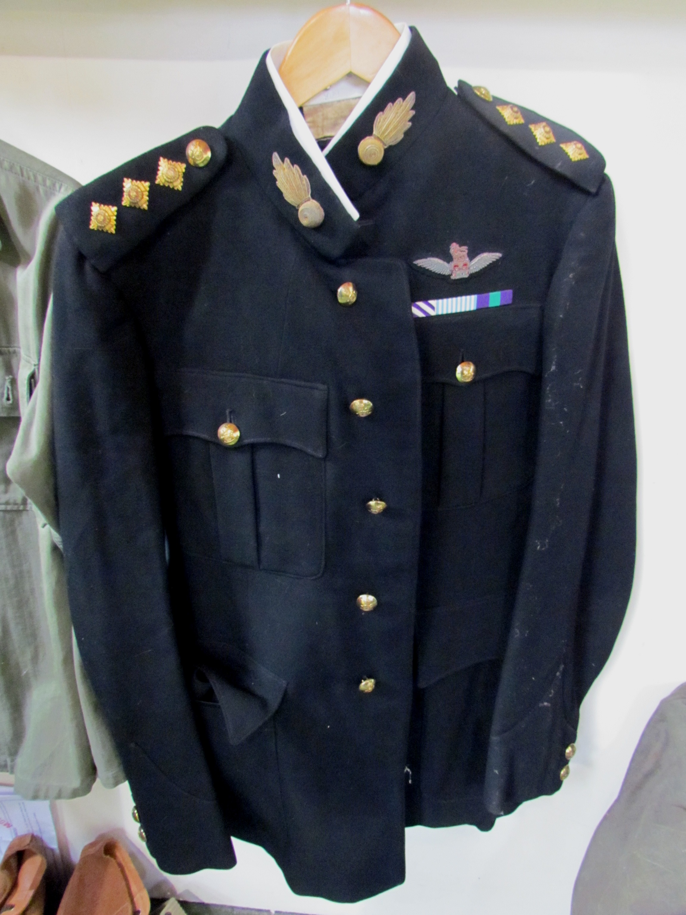 A post-war British Army dress jacket and trousers with King's Crown buttons and DFC bar